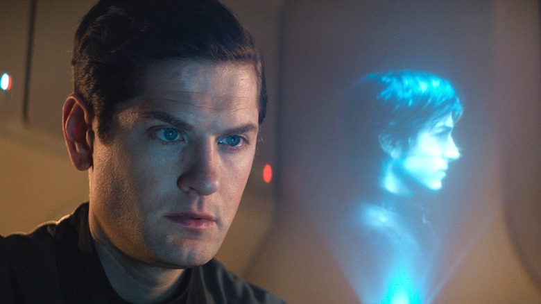 Kyle Soller looking at hologram