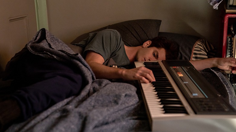 Andrew Garfield playing keyboard