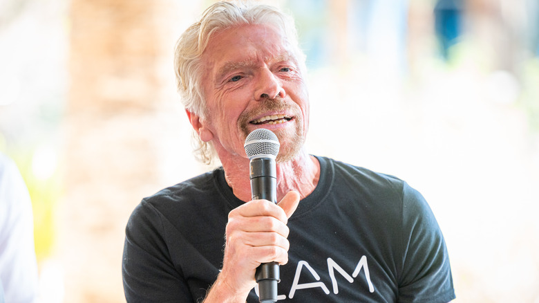 Richard Branson talking with microphone