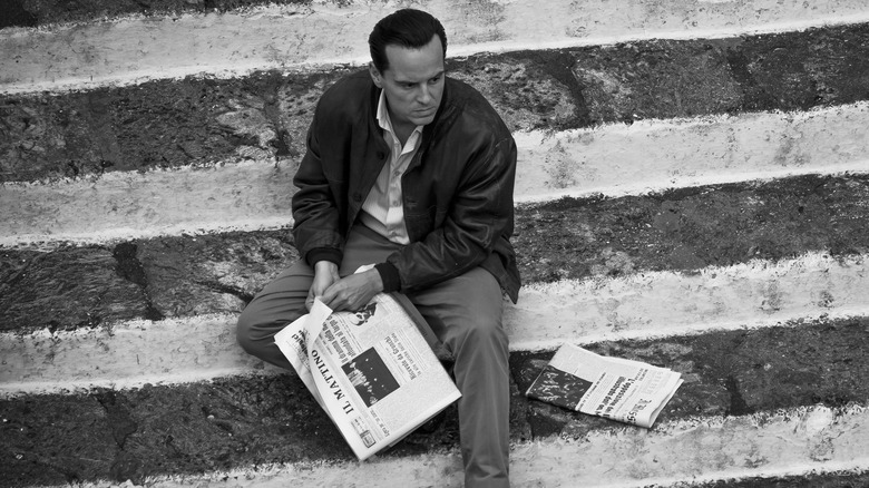 Tom sits on the steps