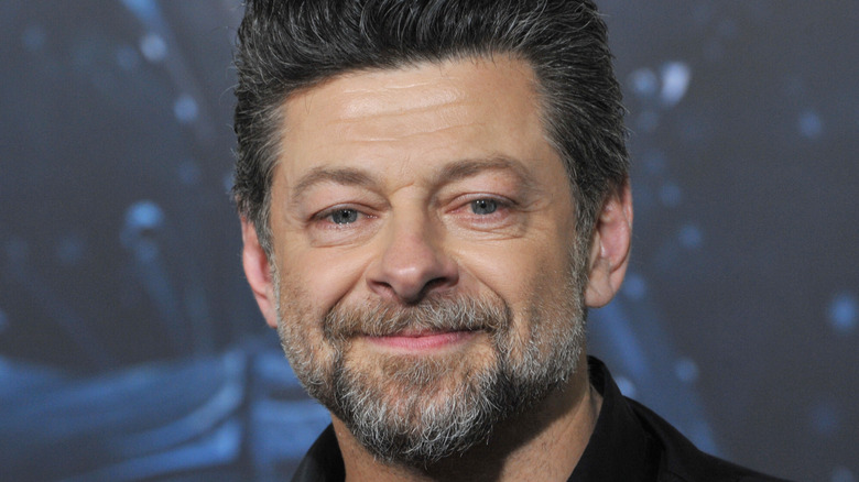 Andy Serkis smiling and wearing black shirt