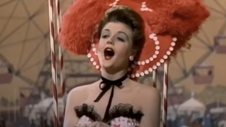 Angela Lansbury singing in black and white dress