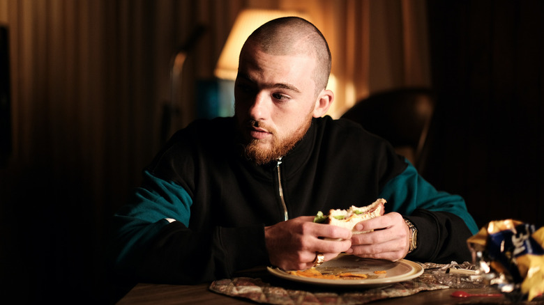 Fez eating sandwich