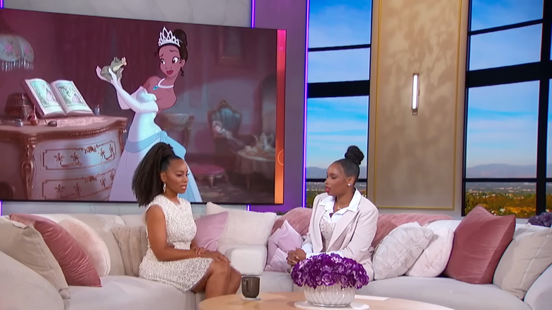 Anika Noni Rose and Jennifer Hudson sitting on a couch