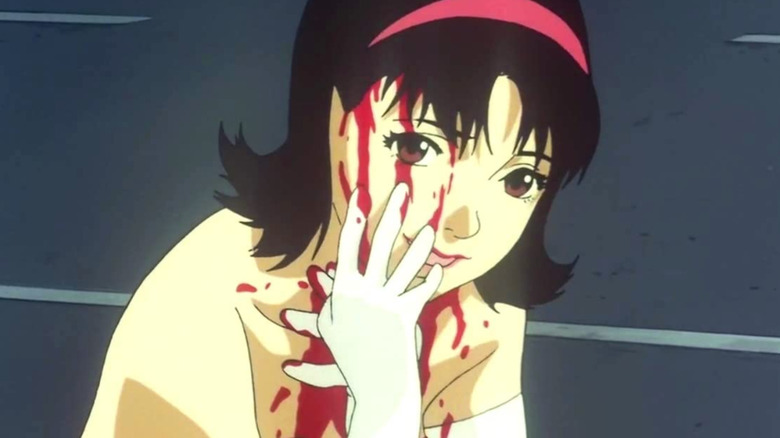 Mima wipes blood on face