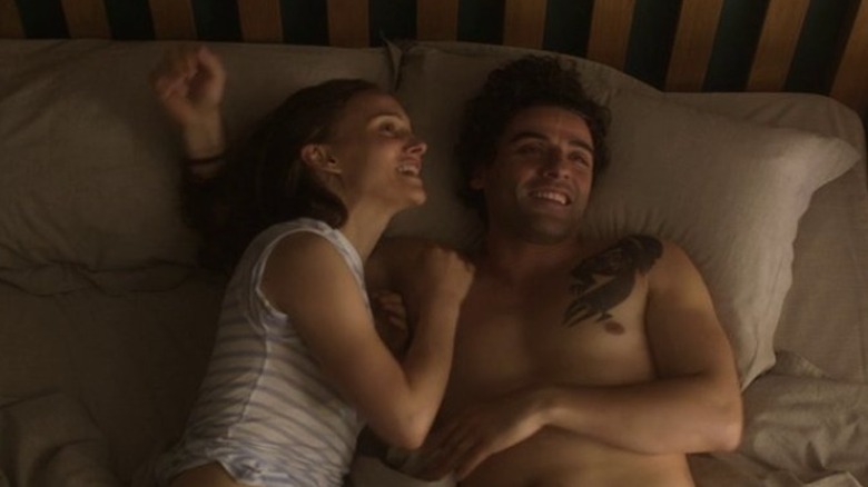 Lena and Kane smile in bed