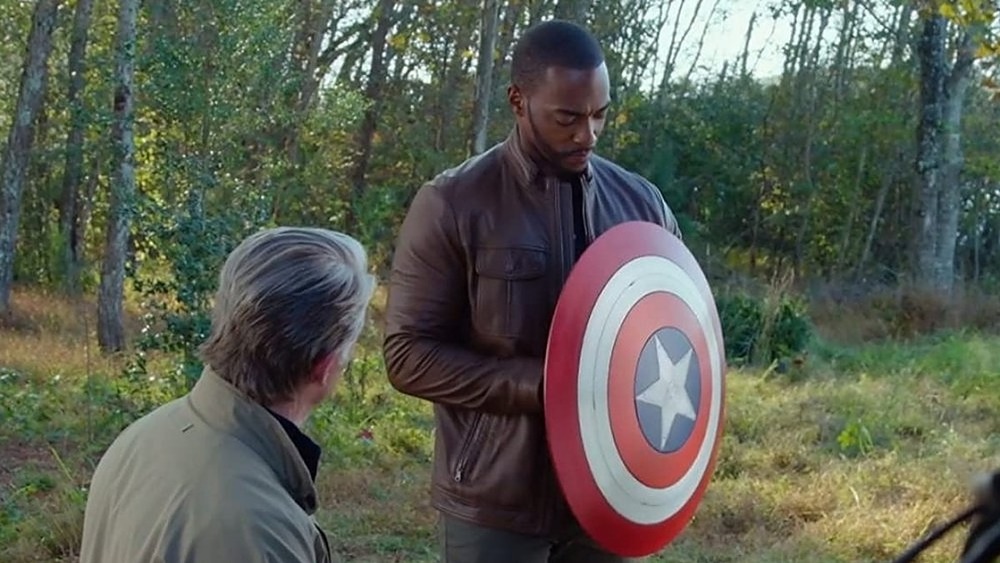 Steve Rogers gives Sam Wilson his shield