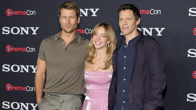 Glen Powell, Sydney Sweeney and Will Gluck pose at CinemaCon