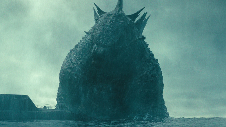 Godzilla looking at boat