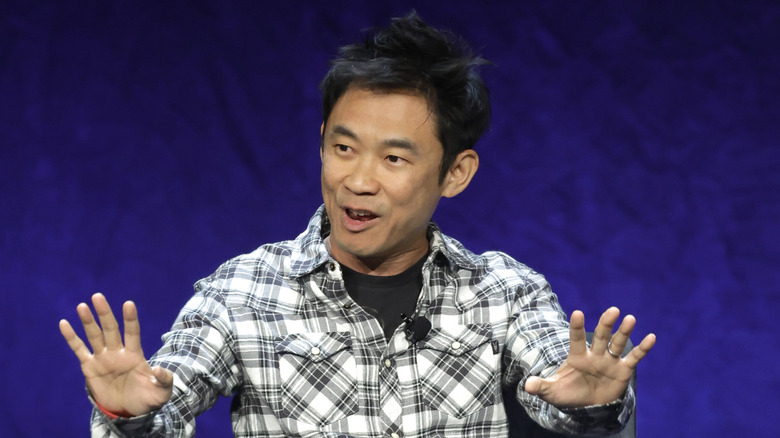 James Wan holding out hands