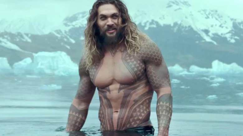 Aquaman standing in water