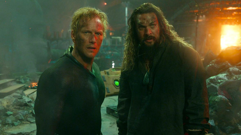 Orm and Aquaman stand side by side