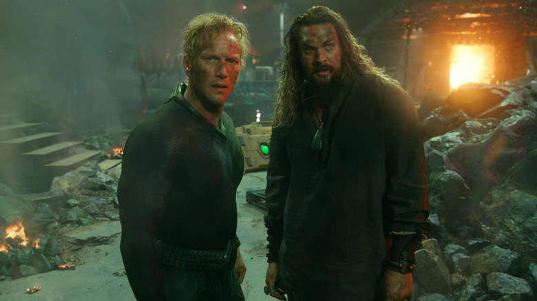 Orm and Arthur Curry standing amongst wreckage