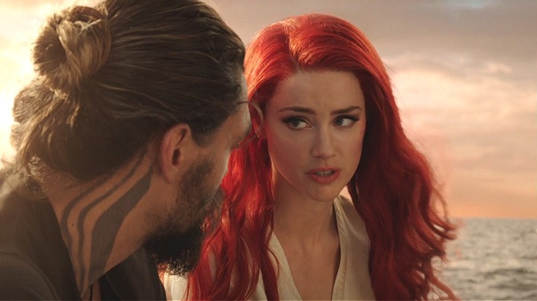 Mera and Aquaman talking on a stolen boat 