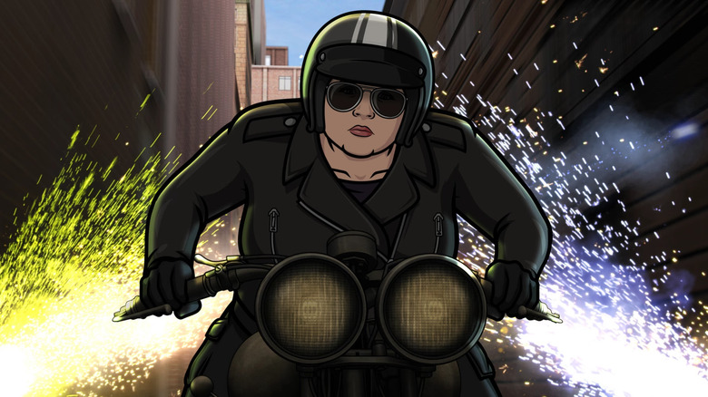 Pam driving a motorcycle