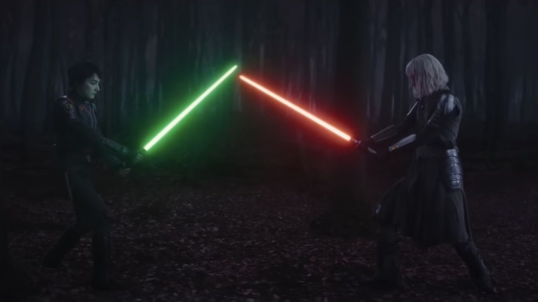 Sabine and Shin wielding lightsabers