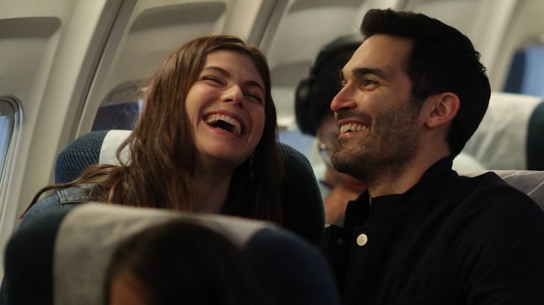 Emma and Jack laughing on a plane