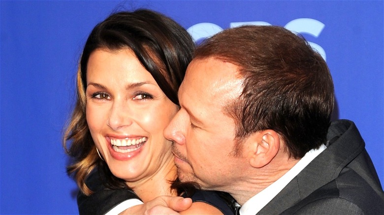 Donnie Wahlberg hugging Bridget Moynahan