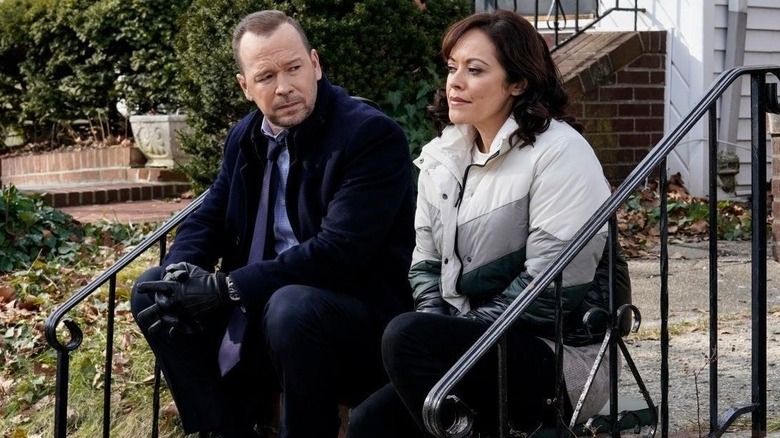 Danny Reagan and Maria Baez talking on a stoop