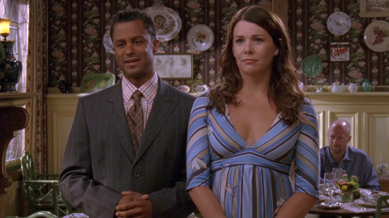 Lorelai and Michel smile 