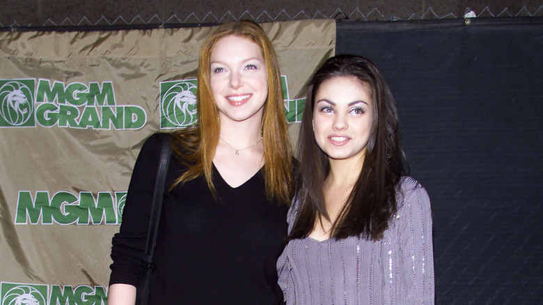 Mila Kunis and Laura Prepon posing