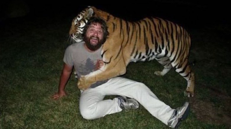 Alan posing with a tiger