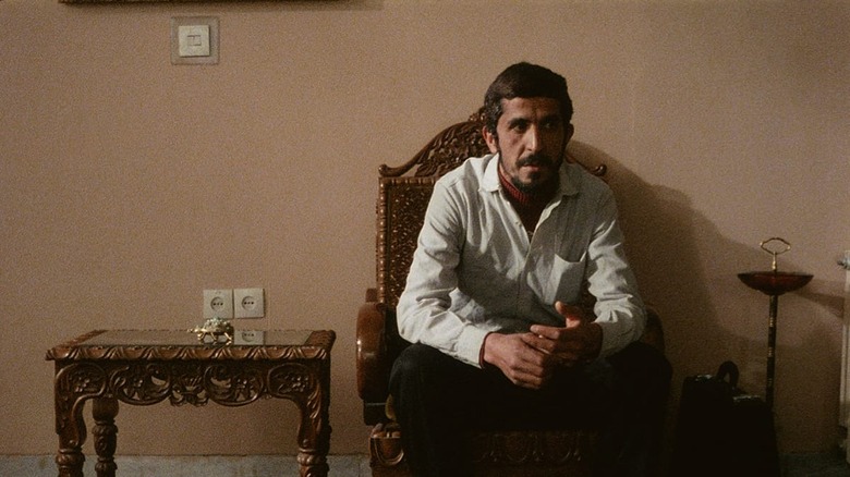 Hossain Sabzian sitting in a chair