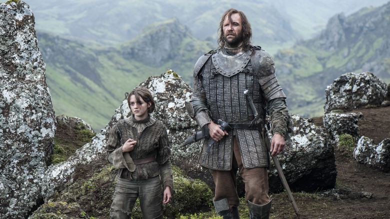 Arya stands next to the Hound