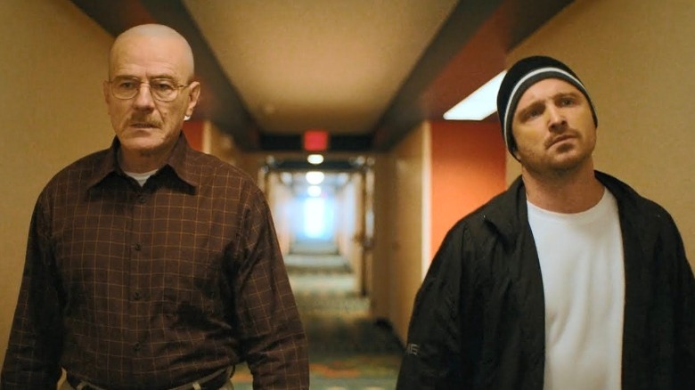 Walter White and Jesse Pinkman walking down a hallway