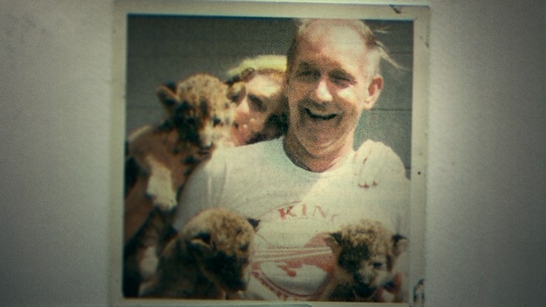 Carole Baskin and Don Lewis holding tiger cubs