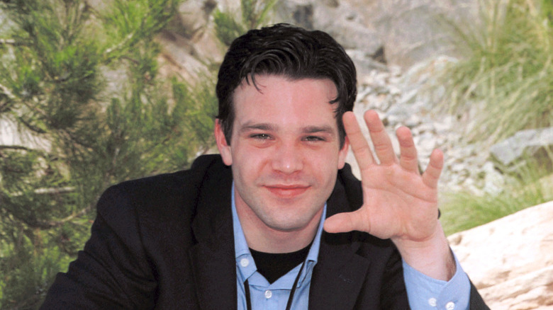 Nathaniel Marston sits at soap opera event table