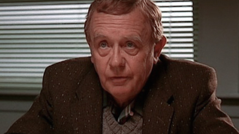 Warren Frost wears a sweater