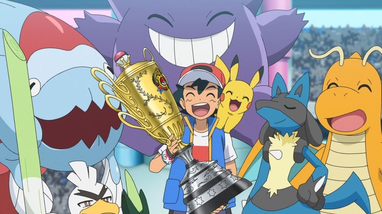 Ash with his Champion trophy 