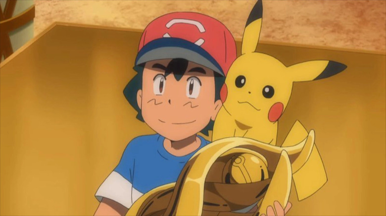 Ash and Pikachu with trophy