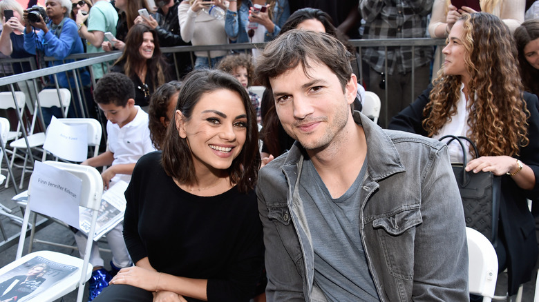 Ashton Kutcher and Mila Kunis smiling 