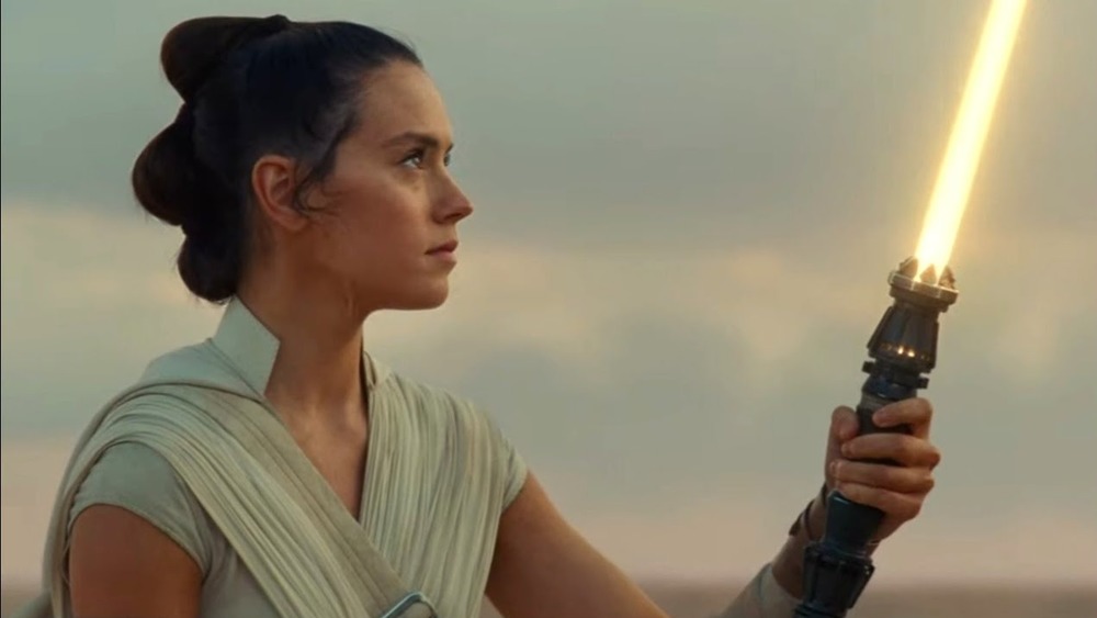 Rey wields her yellow lightsaber