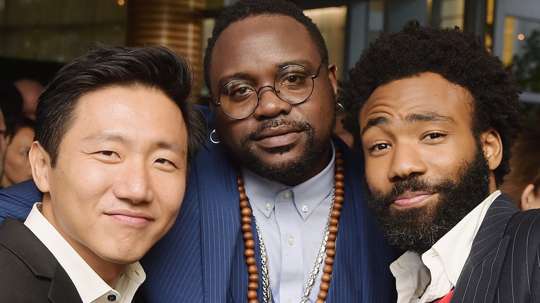 Hiro Murai, Brian Tyree Henry, and Donald Glover at event smiling