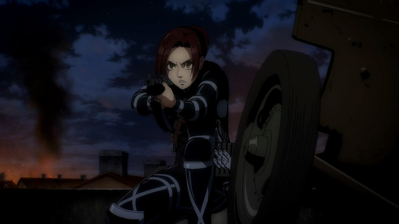 Sasha aims her rifle