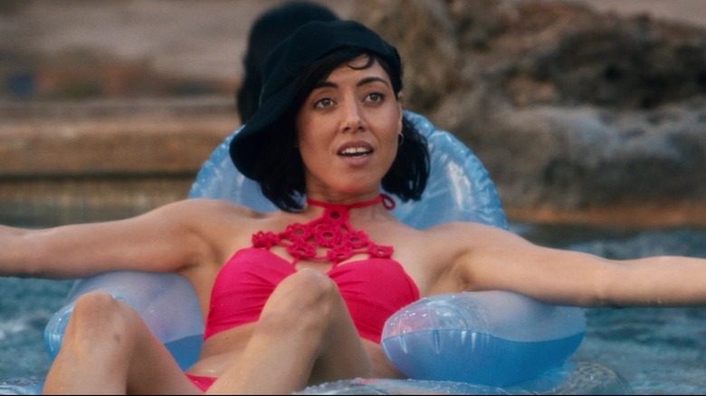 Tatiana sitting in pool floaty