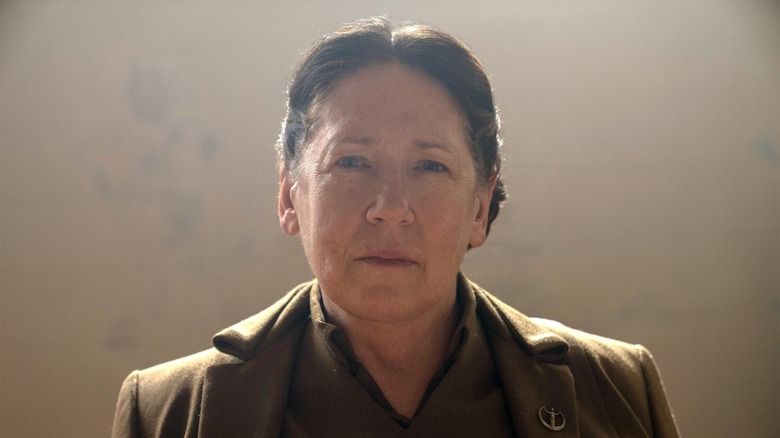 Aunt Lydia wearing brown suit