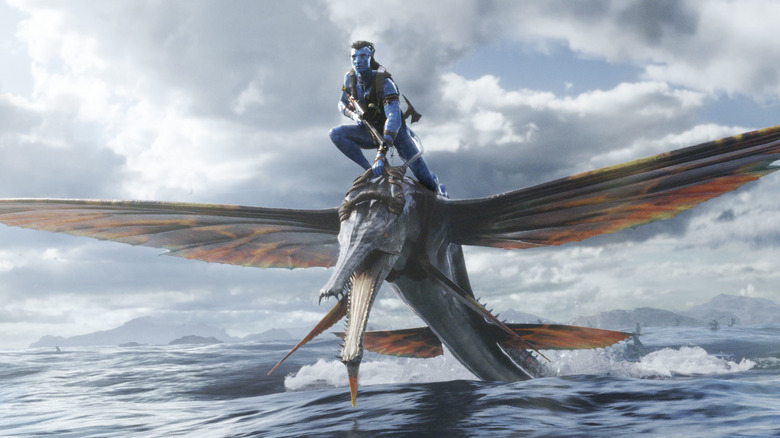 Sam Worthington as avatar Jake Sully on flying water creature