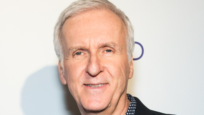 James Cameron smiling into camera