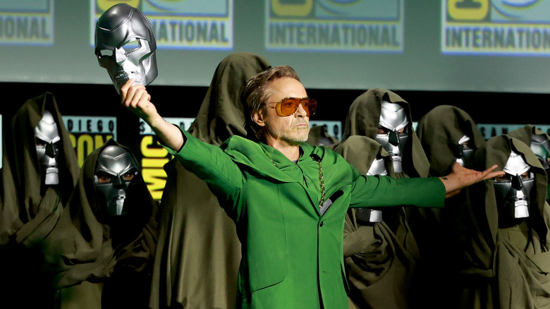 Robert Downey Jr. holding a Doctor Doom mask at Comic-Con