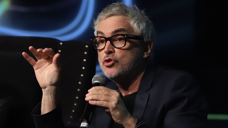 Alfonso Cuarón speaking into microphone