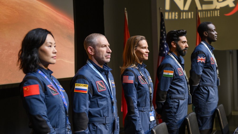 Hilary Swank, Vivian Wu, Ato Essandoh, Mark Ivanir, and Ray Panthak portray astronauts in Away 