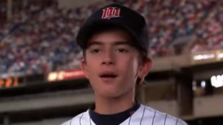 Billy talking in close-up on the baseball field