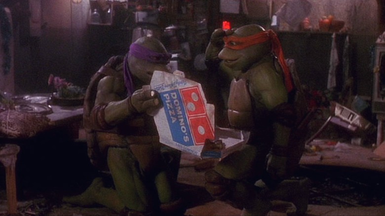 Donatello and Raphael eating Domino's