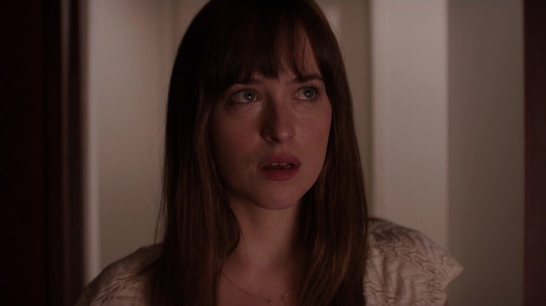 Dakota Johnson staring