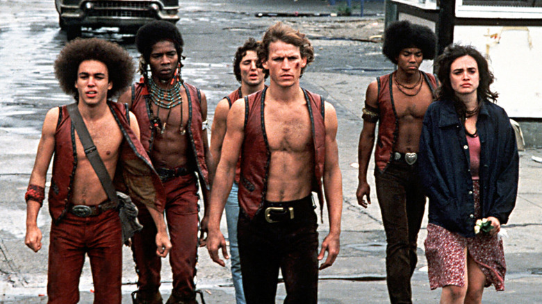 The Warriors walk down a street in The Warriors (1979)