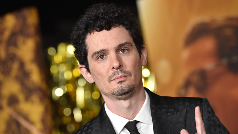 Damien Chazelle wearing suit and tie